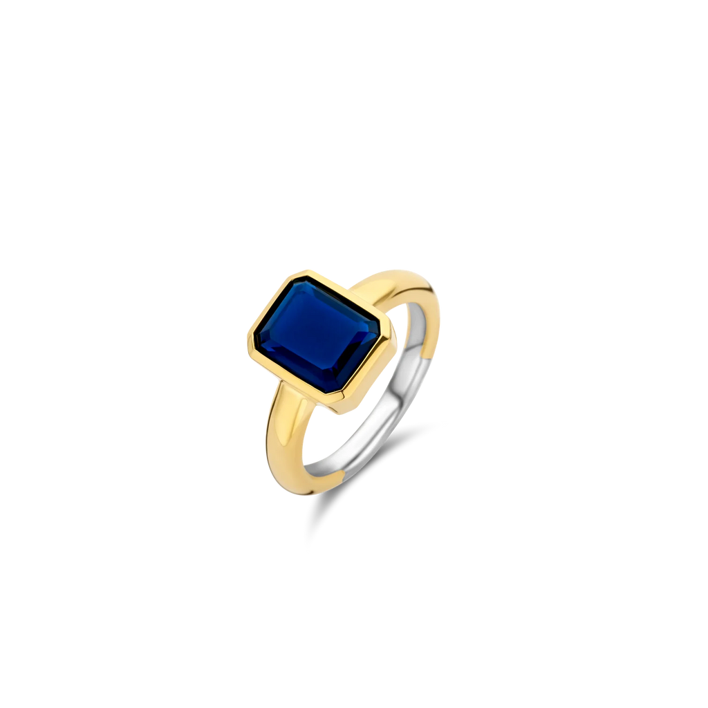 Anillo de plata bañada en oro amarillo con piedra azul