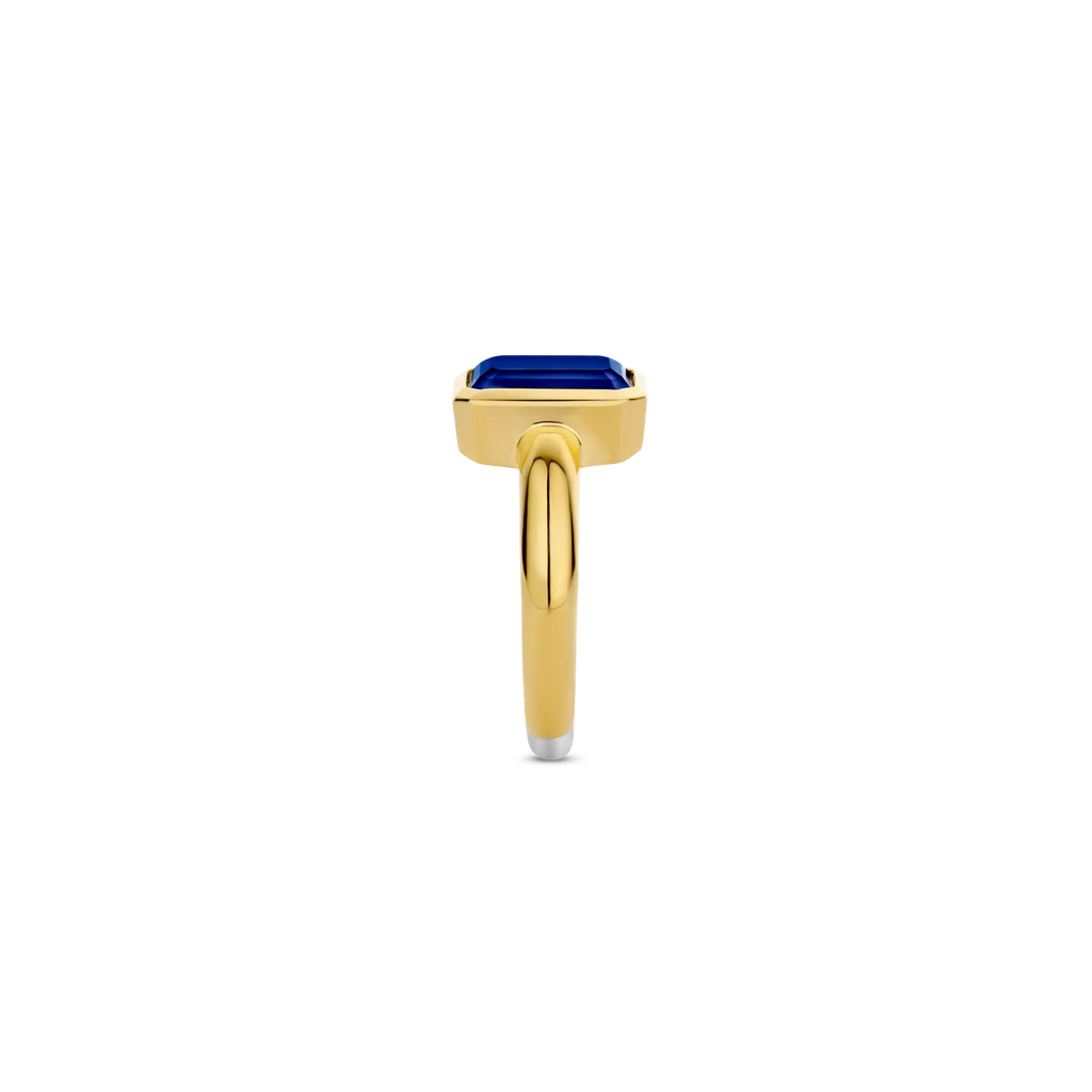 Anillo de plata bañada en oro amarillo con piedra azul
