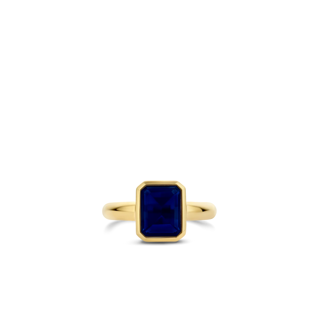 Anillo de plata bañada en oro amarillo con piedra azul