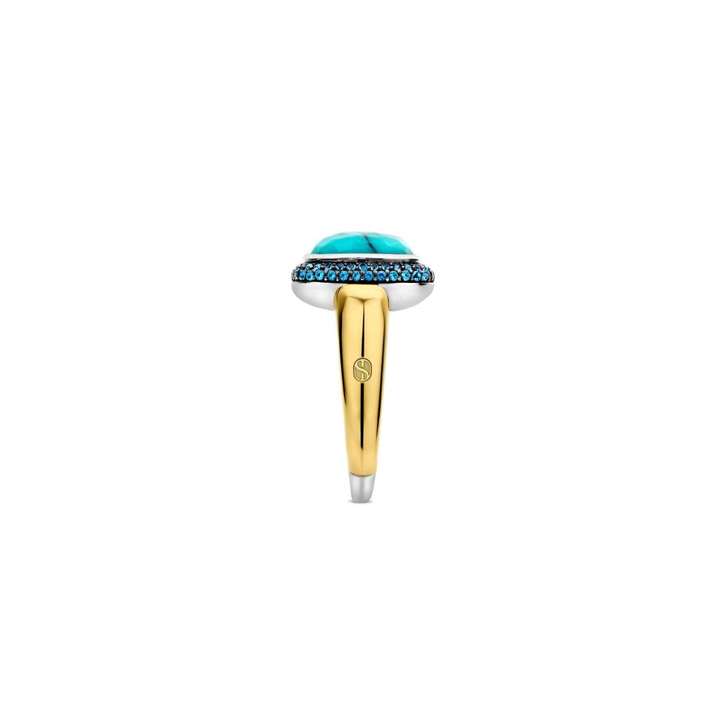 Anillo de plata dorada con piedra turquesa