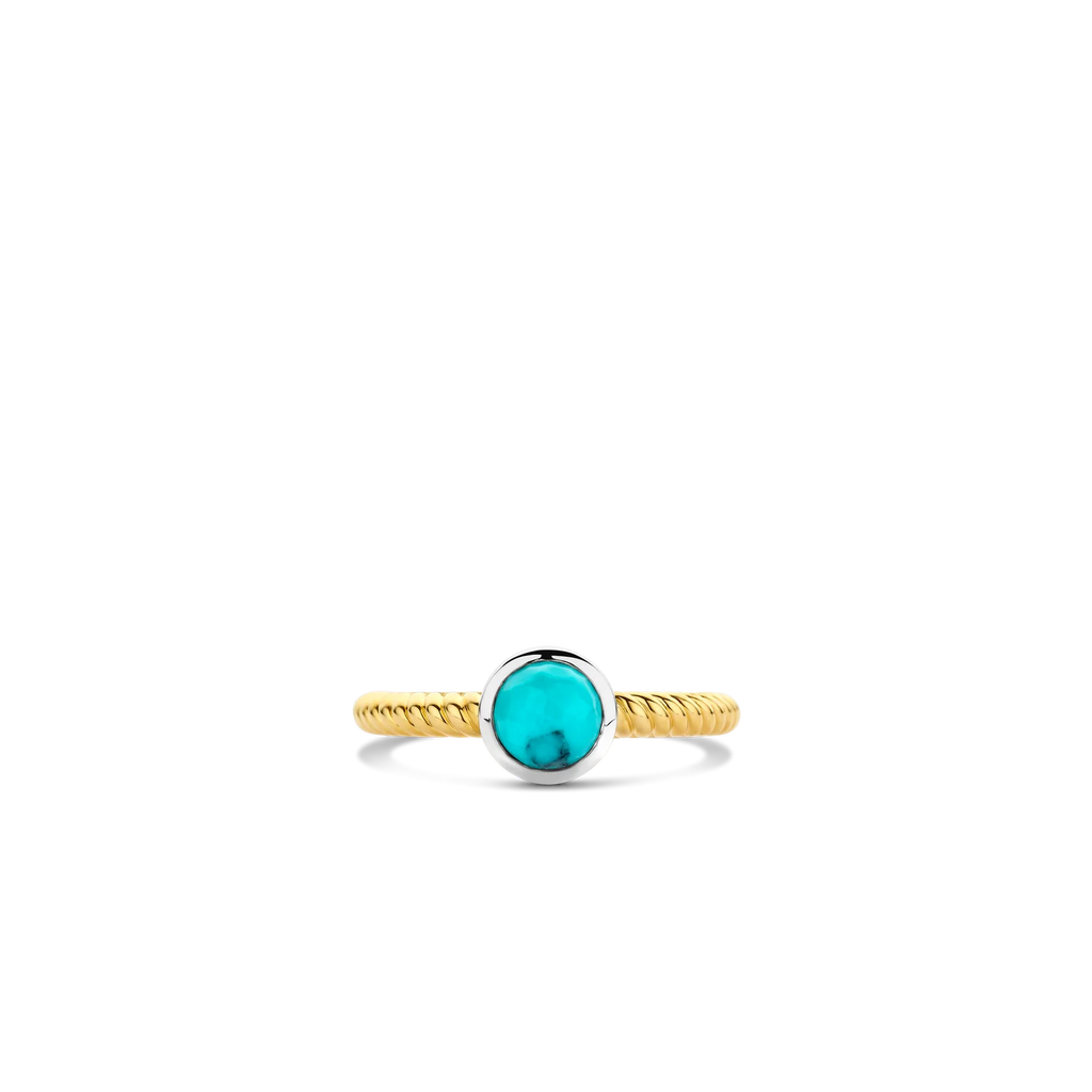 Anillo de plata bañada en oro amarillo con piedra turquesa