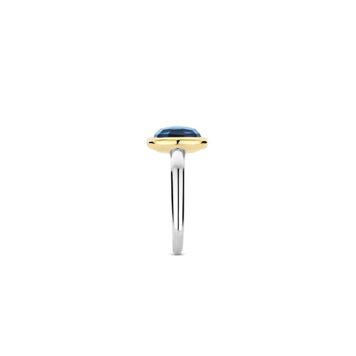 Anillo de plata bañada en oro con piedra azul