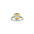 Anillo de plata bañada en oro con piedra azul