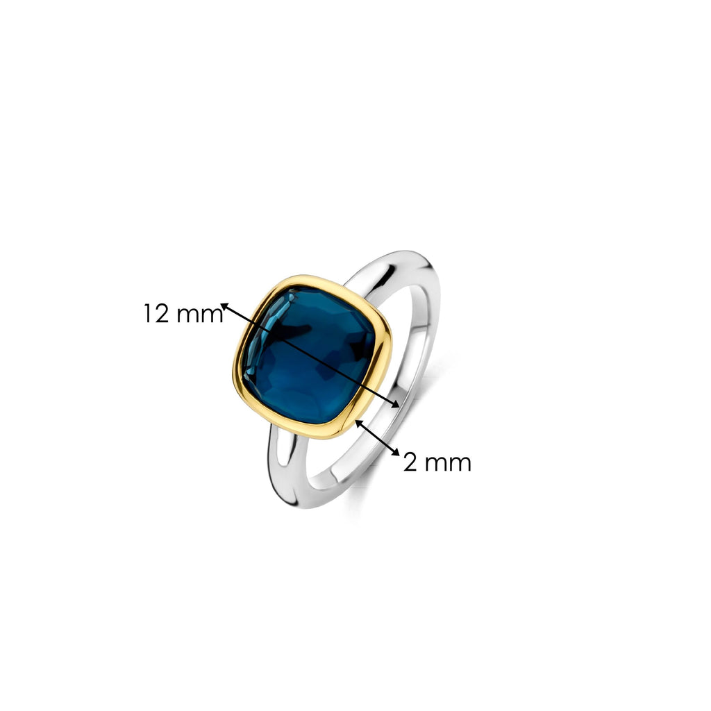 Anillo de plata bañada en oro con piedra azul