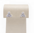 Aretes de 18K oro blanco flor triple brillantes